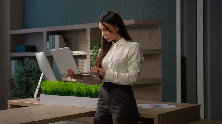 Serious busy Caucasian business girl company owner chatting consulting corporate clients online